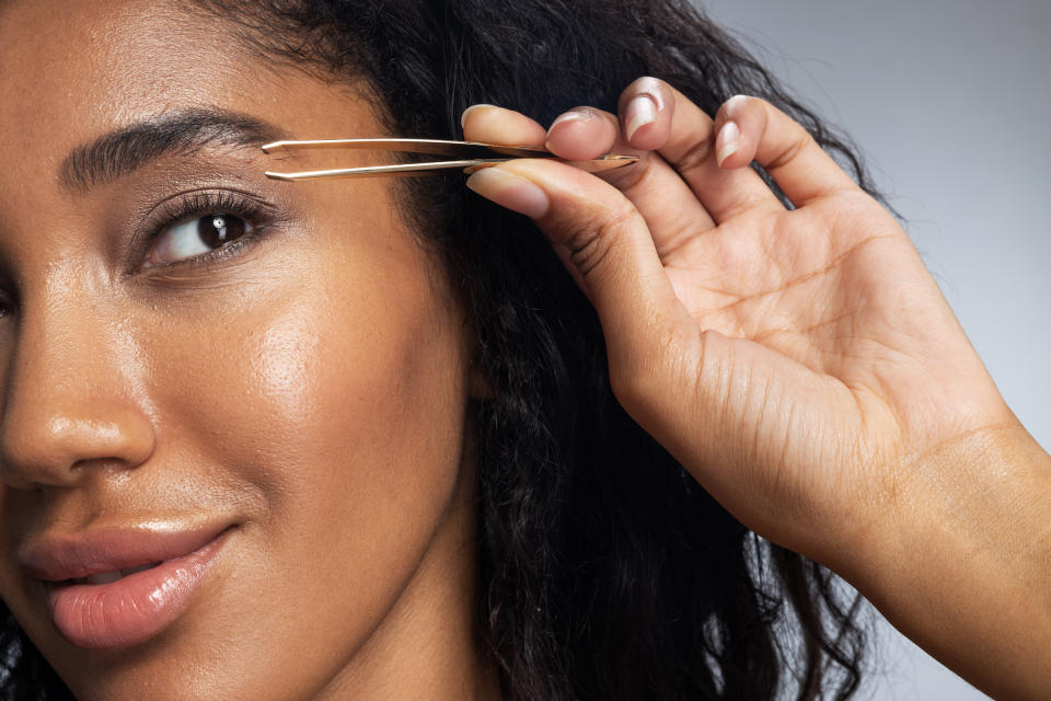 Before you reach for the tweezers or razor, look for products and hacks that'll slow and maintain your hair growth. (Photo: yacobchuk via Getty Images)