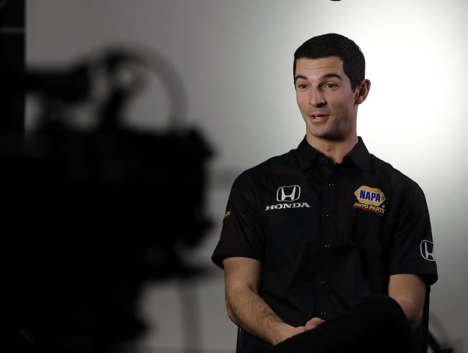 Defending Indianapolis 500 champion Alexander Rossi responds to a question during IndyCar Series annual media day Wednesday, Jan. 18, 2017, in Indianapolis. (AP Photo/Darron Cummings)