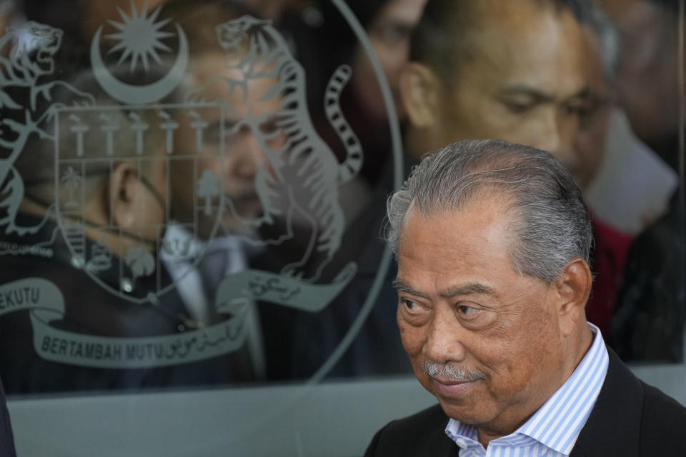 Malaysia's former Prime Minister Muhyiddin Yassin walks out of courthouse, after charged with corruption and money laundering, in Kuala Lumpur, Malaysia, Friday, March 10, 2023. Former Prime Minister Muhyiddin Yassin has been charged with corruption and money laundering, making him Malaysia's second ex-leader to be indicted after leaving office. Muhyiddin pleaded innocent Friday to four charges of corruption and two charges of money laundering. (AP Photo/Vincent Thian)