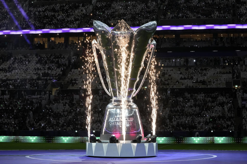 A giant replica of the trophy is displayed on the pitch before the Asian Cup Group A soccer match between Qatar and Lebanon at the Lusail Stadium in Lusail, Qatar, Friday, Jan. 12, 2024. (AP Photo/Thanassis Stavrakis)