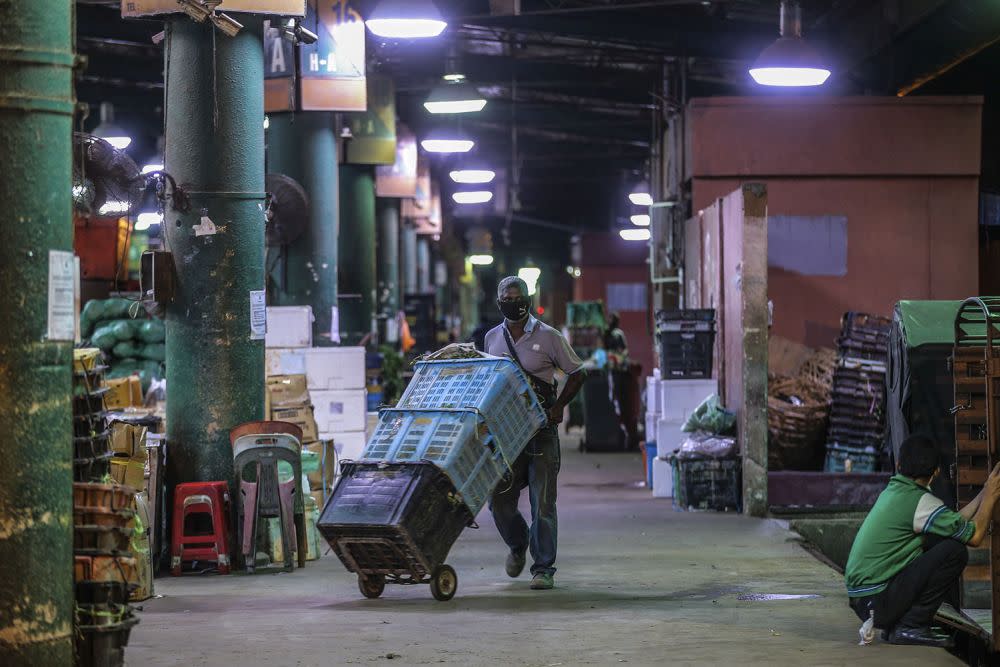 A general view of the Kuala Lumpur Wholesale Market as traders resumed business after the enhanced movement control order on the area was lifted on May 13, 2020. — Pictures by Hari Anggara