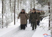 This undated photo provided on Wednesday, Dec. 4, 2019, by the North Korean government shows North Korean leader Kim Jong Un, center, visits Mount Paektu area, North Korea. North Korea says leader Kim has taken a second ride on a white horse to a sacred mountain in less than two months. Independent journalists were not given access to cover the event depicted in this image distributed by the North Korean government. The content of this image is as provided and cannot be independently verified. Korean language watermark on image as provided by source reads: "KCNA" which is the abbreviation for Korean Central News Agency. (Korean Central News Agency/Korea News Service via AP)