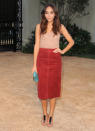 Actress Ashley Madekwe put together an outfit only a true fashion blogger. which she doubles as, can. In a red suede skirt, knit tank, and turquoise clutch, she was effortlessly elegant.