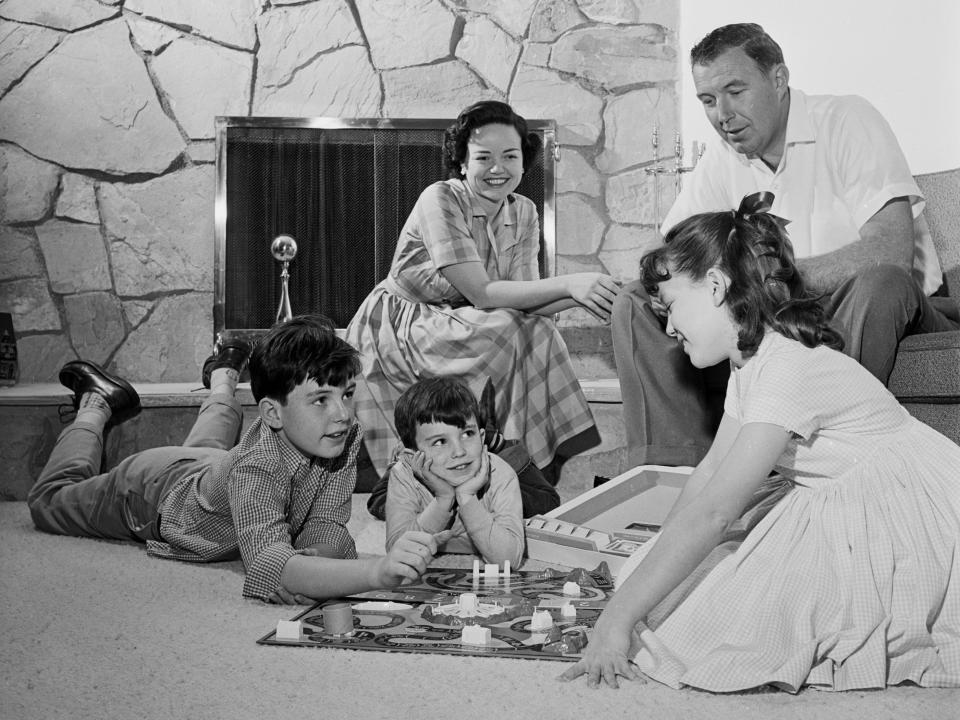 The Mathers family plays the game of Life.