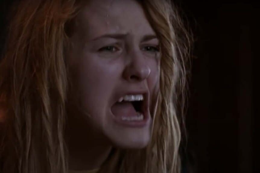 A sweaty, disheveled Laurie Strode (Scout Taylor-Compton) screams in Halloween II (2009).