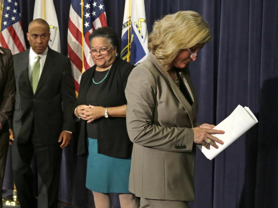 Dr. Madeleine Biondolillo, Director of the Mass. Bureau of Healthcare Safety, right, leaves at the conclusion of a news conference regarding the Massachusetts pharmacy responsible for the meningitis outbreak during a news conference at the Statehouse in Boston, Tuesday, Oct. 23, 2012. The outbreak of meningitis, an inflammation of the lining of the brain and spinal cord, has sickened nearly 300 people, including 23 who died, in more than a dozen states. From left are Mass. Gov. Deval Patrick, Mass. Health and Human Services Secretary JudyAnn Bigby and Biondolilo. (AP Photo/Charles Krupa)