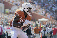 Texas wide receiver Xavier Worthy (8) catches a touchdown pass against Texas Tech during the first half of an NCAA college football game on Saturday, Sept. 25, 2021, in Austin, Texas. (AP Photo/Chuck Burton)