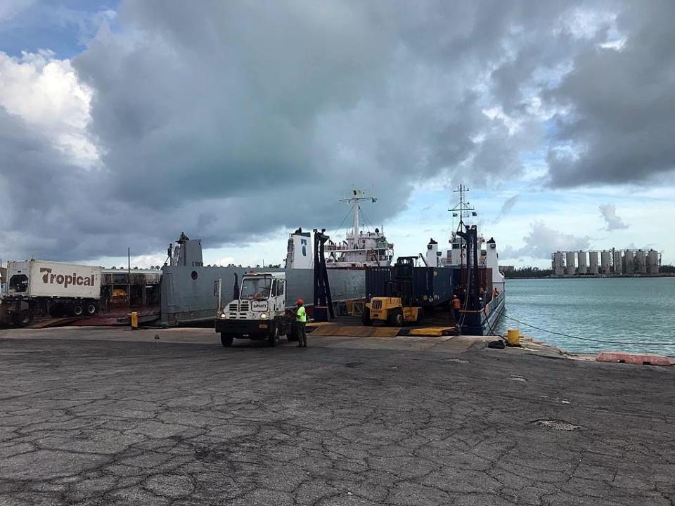 Aid arriving at Freeport, Bahamas port are unloaded on Thursday, September 5, 2019.(Pedro Portal/Miami Herald via AP)