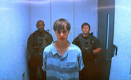 Dylann Storm Roof appears by closed-circuit television at his bond hearing in Charleston, South Carolina June 19, 2015 in a still image from video. REUTERS/POOL