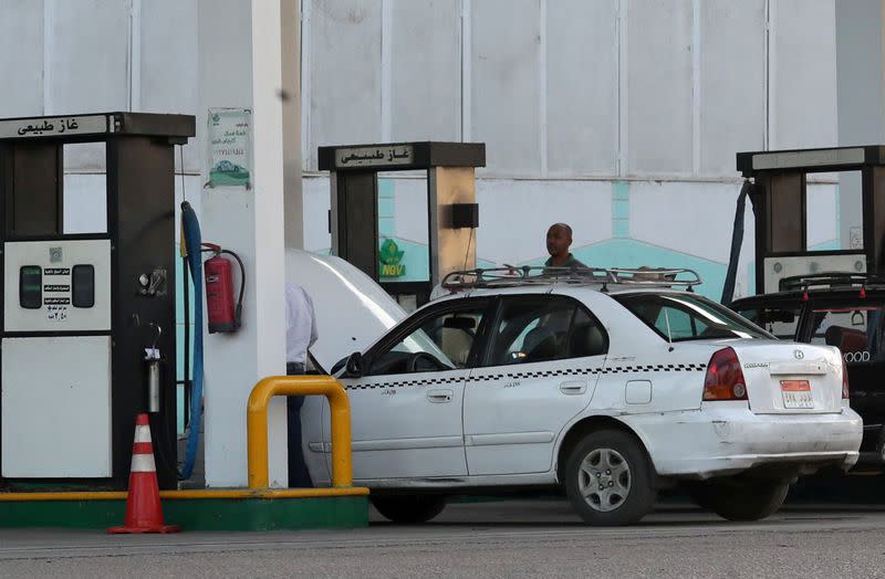 A taxi is filled up with gas at Natural Gas Vehicles (NGV) petrol station in Cairo