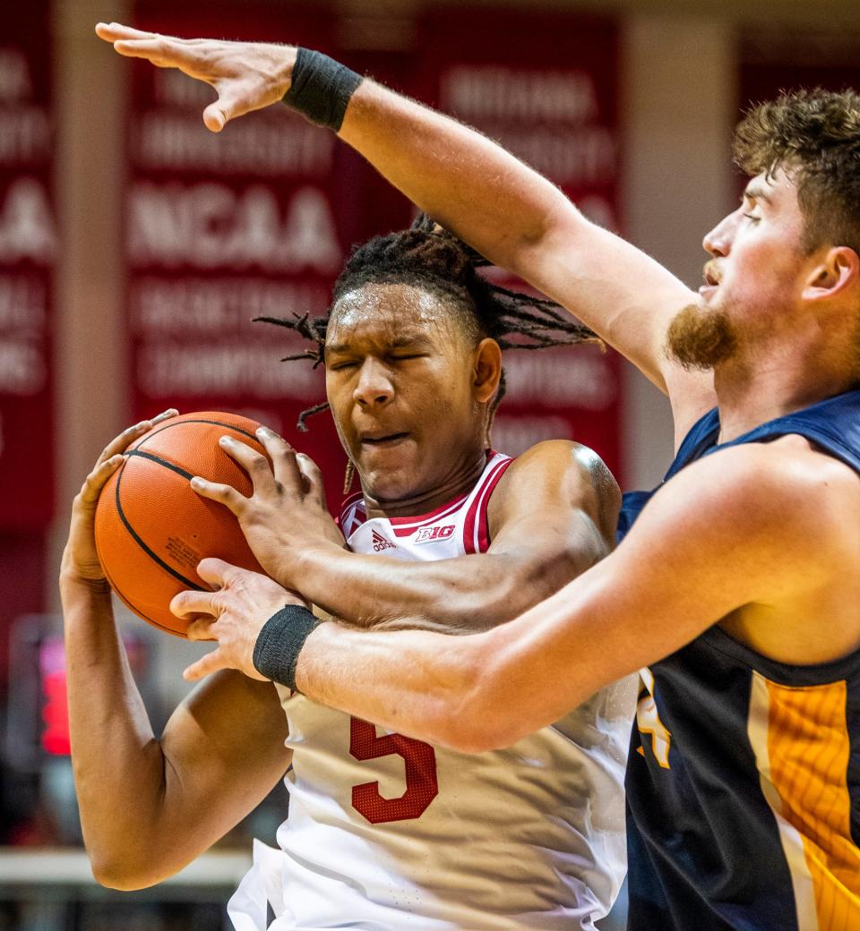 Indiana's Malik Reneau (5) grabs a rebound during the first half of the Indiana versus Marian men's basketball game at Simon Skjodt Assembly Hall on Saturday, Oct. 29, 2022.