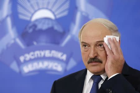 Belarus' President Alexander Lukashenko wipes his face at a news conference during a presidential election in Minsk, Belarus, October 11, 2015. REUTERS/Vasily Fedosenko/File Photo