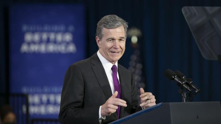 North Carolina Governor Roy Cooper speaks before President Joe Biden speaks to guests during a visit to North Carolina Agricultural and Technical State University on April 14, 2022 in Greensboro, North Carolina. <span class="copyright">Photo by Allison Joyce/Getty Images</span>