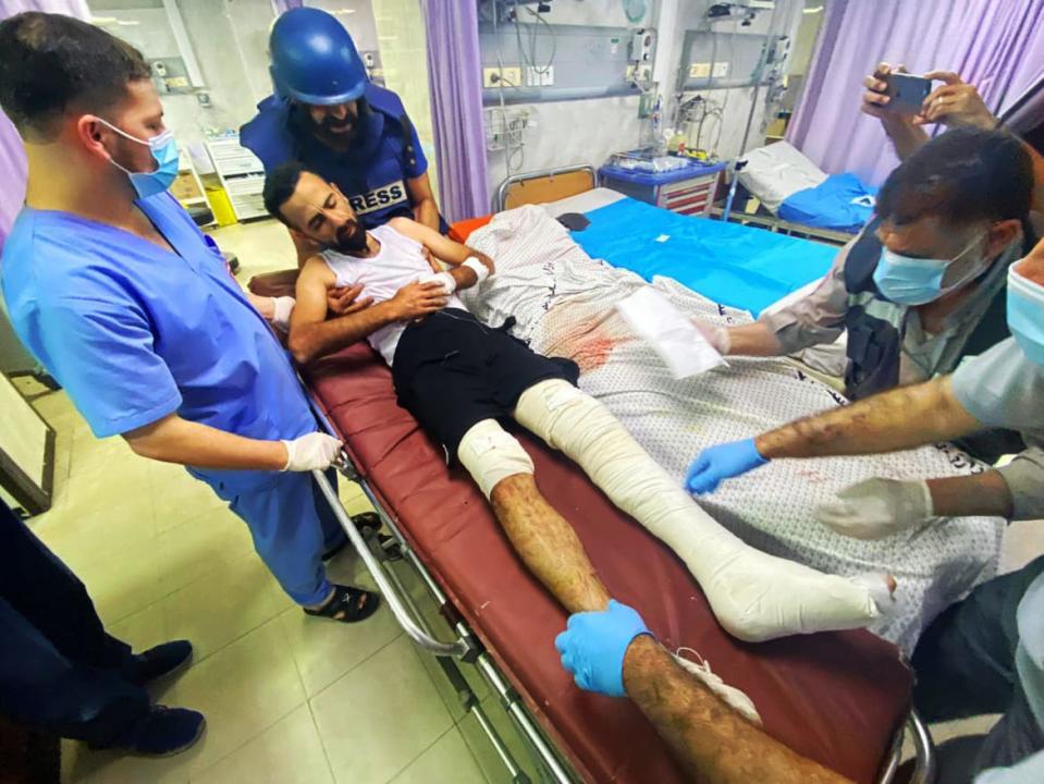 <div class="inline-image__caption"><p>Anadolu Agency's cameraman Mohammad Alaloul is stretchered into hospital.</p></div> <div class="inline-image__credit">Ali Jadallah/Anadolu Agency/Getty</div>