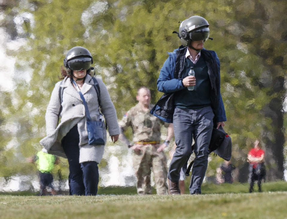 People ahead of boarding an RAF Chinook Helicopter from RAF Odiham that landed on the Stray in Harrogate, Yorkshire. It was carrying out operations in support of the NHS, as the UK continues in lockdown to help curb the spread of the coronavirus.