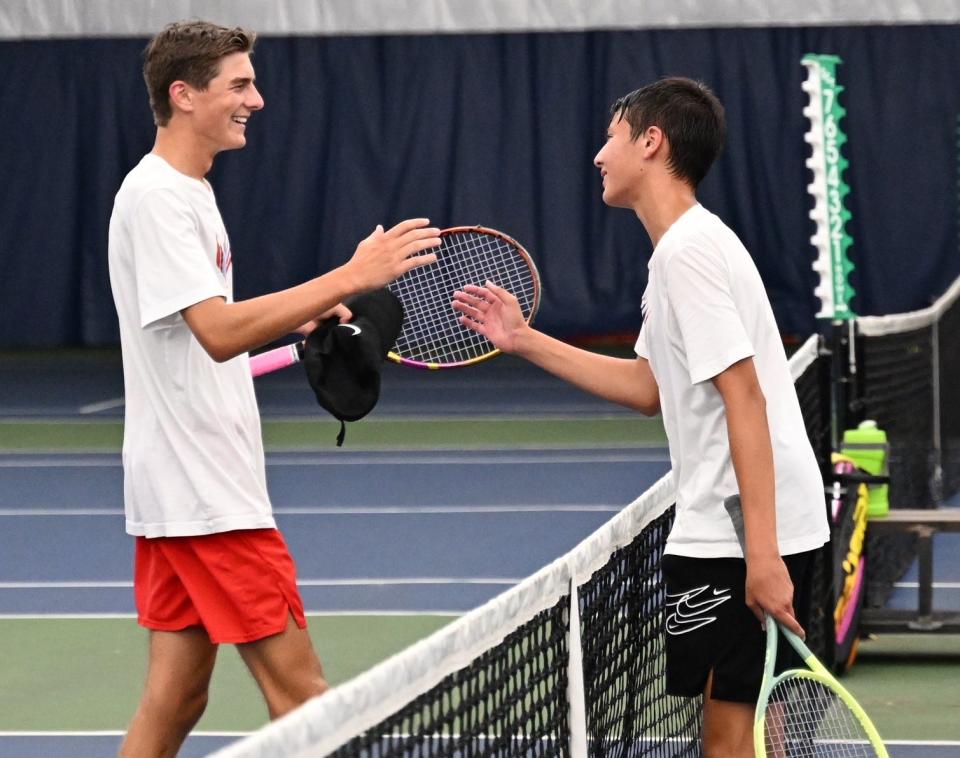 Dylan Catanese and Cooper Remy meet at the net after squaring off in the finals of boys 16 singles in the 90th News Journal Tennis Tournament.