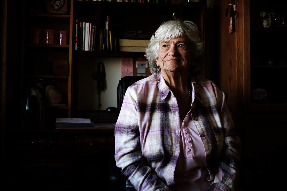 Kasey Dungan, 73, sits in her subsidized apartment in Phoenix, Ariz. for older adults on Monday, Dec. 12, 2022, and says she feels fortunate. She fell into homelessness early this year. But high costs for food and other bills mean her entire Social Security check is gone by month's end. (AP Photo/Cheyanne Mumphrey)