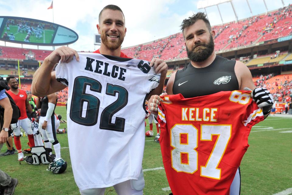 Kansas City Chiefs tight end Travis Kelce, left, and his brother, Philadelphia Eagles center Jason Kelce (62) exchange jerseys following an NFL football game in Kansas City, Mo., on Sept. 17, 2017. For the first time in Super Bowl history, a pair of siblings will square off in the big game.