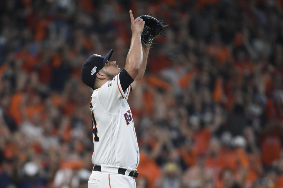 Houston Astros relief pitcher Roberto Osuna celebrates his team's win over the Tampa Bay Rays in the ninth inning during Game 1 of a best-of-five American League Division Series baseball game in Houston, Friday, Oct. 4, 2019. (AP Photo/Eric Christian Smith)