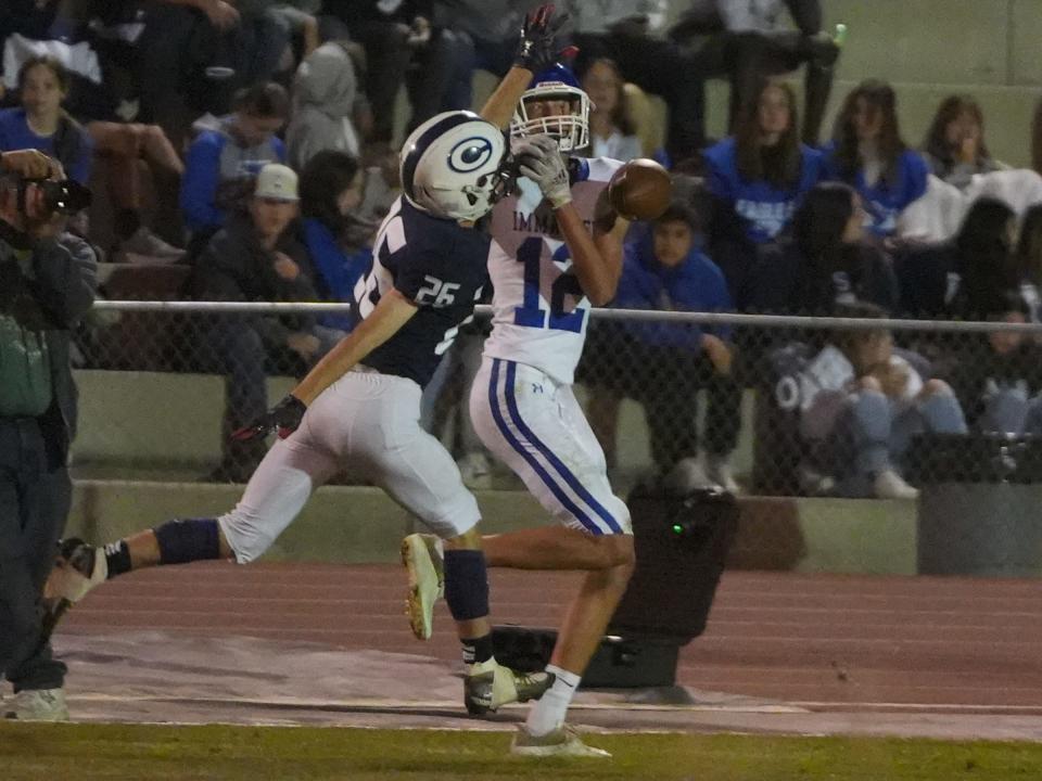 CVC’s Bryce Crook breaks up a catch attempt by Immanuel’s Noah Schletewitz late in the first half Friday night in Visalia.