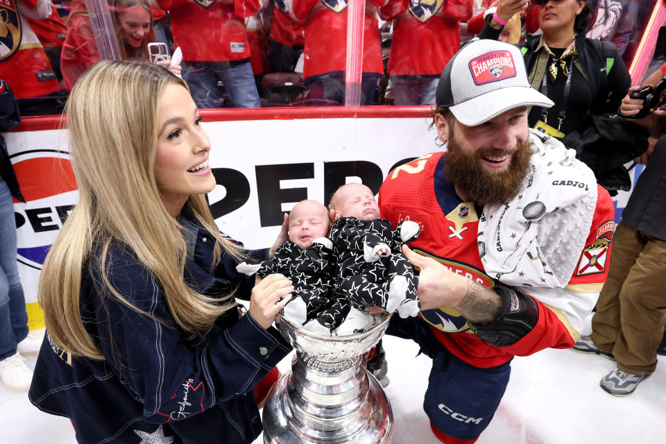 Jonah Gadjovich poses with his wife, Allison, and twins, Lion and Adalee. (Bruce Bennett/Getty Images)