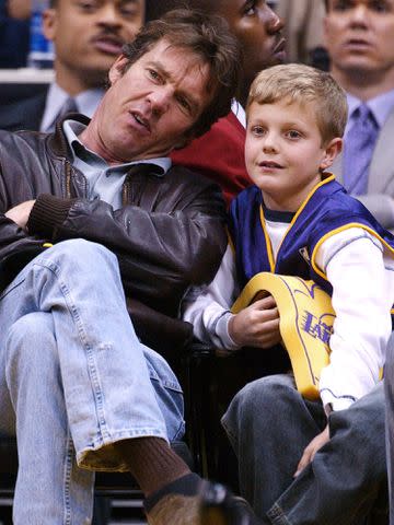 <p>Vince Bucci/Getty</p> Dennis Quaid and son Jack attend the game between the Los Angeles Lakers and the Portland Trailblazers on February 21, 2003.