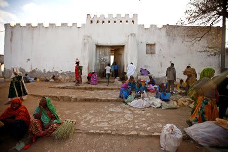 People sit outside the walled city of Harar, Ethiopia, February 24, 2017. REUTERS/Tiksa Negeri