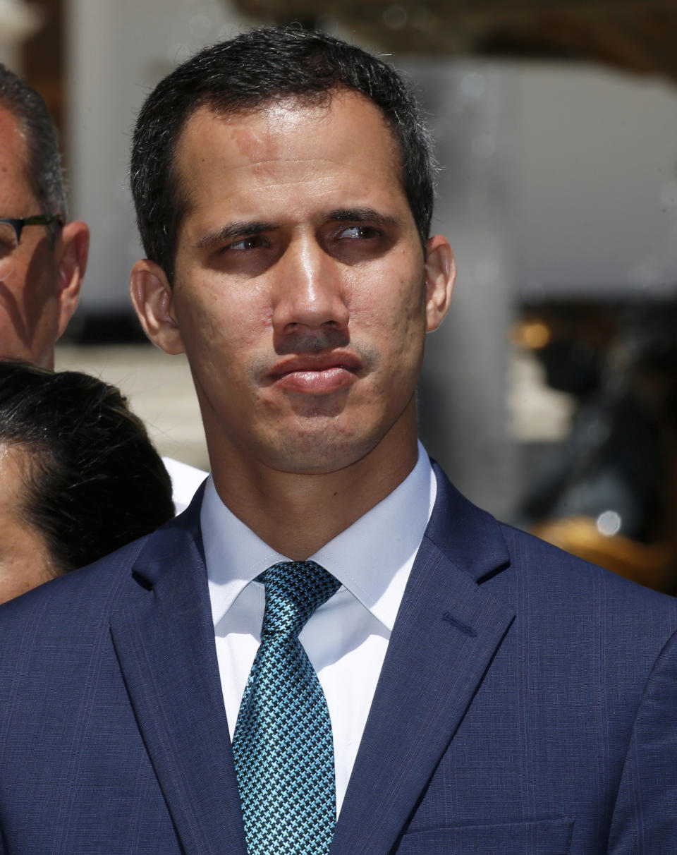 Opposition leader Juan Guaido, who has declared himself the interim president of Venezuela, listens to a question during a press conference on the steps of the National Assembly in Caracas, Venezuela, Monday, Feb. 4, 2019. Germany, Spain, France, the U.K. and Sweden have announced that they are recognizing Guaido as the country's interim president and are urging him to hold a new presidential election.(AP Photo/Fernando Llano)