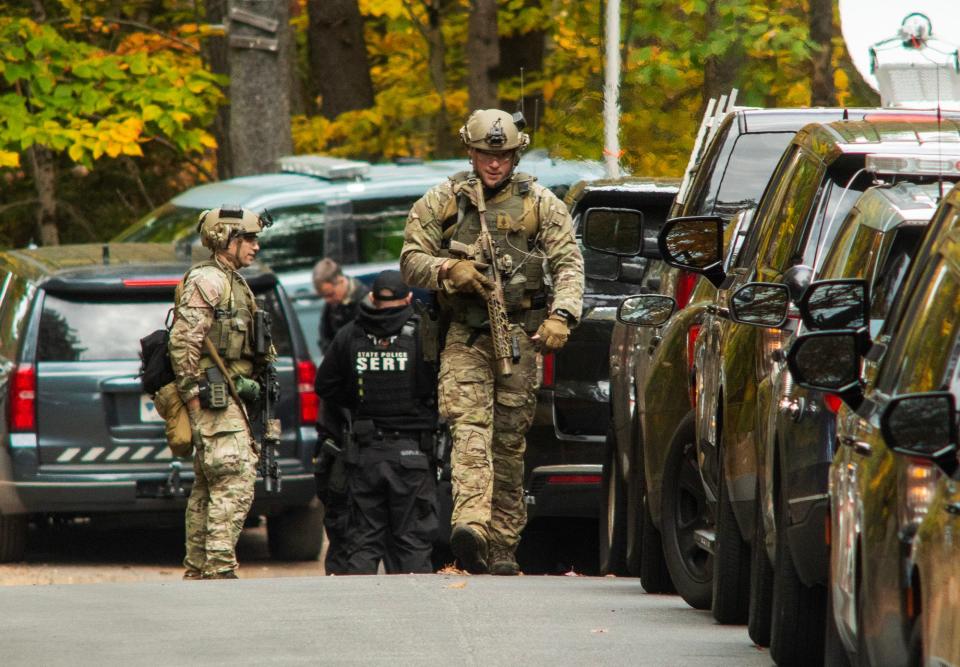 GARDNER - Mass. State Police troopers gather at the intersection of Kelton Street and Camp Collier Road as the search continues for Aaron M. Pennington Tuesday, October 24, 2023.