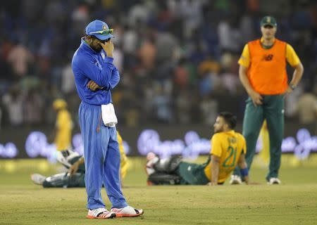 India's Virat Kohil reacts after the match was disrupted due to water bottles thrown by spectators during the second Twenty20 cricket match against South Africa in Cuttack, India, October 5, 2015. REUTERS/Danish Siddiqui