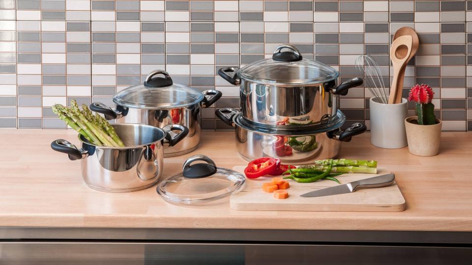 steel cookware set with modern kitchen.