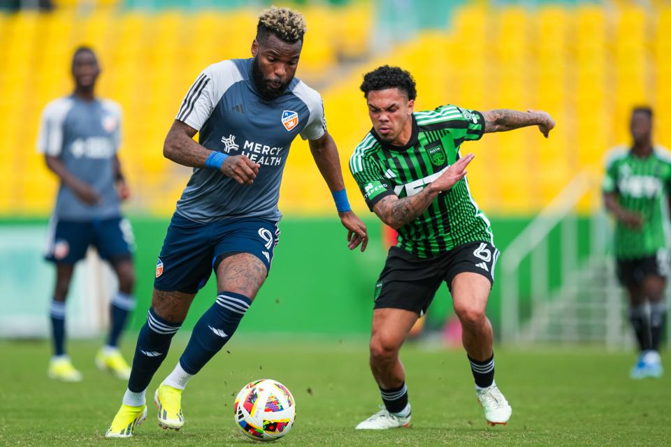 FC Cincinnati forward Aaron Boupendza dribbles past an Austin FC player during a Jan. 26 preseason match at Al Lang Stadium in St. Petersburg, Florida. Austin beat Cincinnati, 2-1.