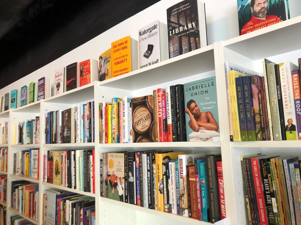 Books line a long wall at the Bear Den Books store on June 28, 2022, shortly before its soft opening.
