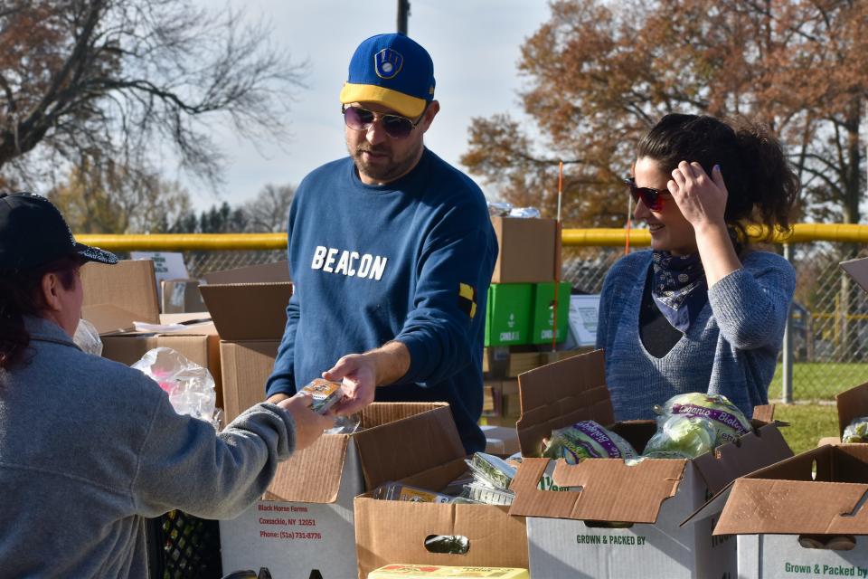Volunteers distribute hundreds of pounds of produce at Fareground's annual pre-Thanksgiving food distribution in Beacon on Saturday, Nov. 17.