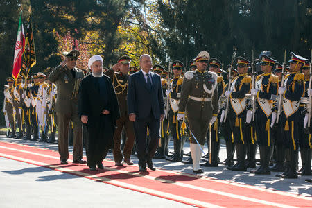 Iraq's President Barham Salih walks with Iran's President Hassan Rouhani during an official reception ceremony in Tehran, Iran, November 17, 2018. Official President website/Handout via REUTERS