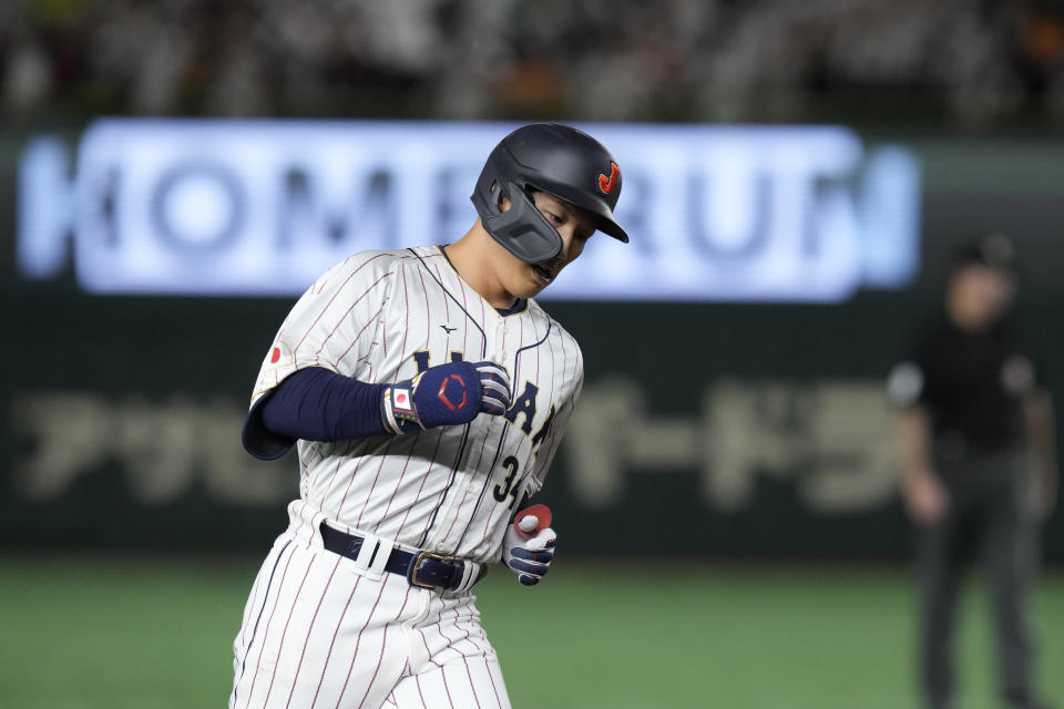 Masataka Yoshida of Japan runs the bases after hitting a solo home run during the seventh inning of the quarterfinal game between Italy and Japan at the World Baseball Classic (WBC) at Tokyo Dome in Tokyo, Japan, Thursday, March 16, 2023. (AP Photo/Eugene Hoshiko)