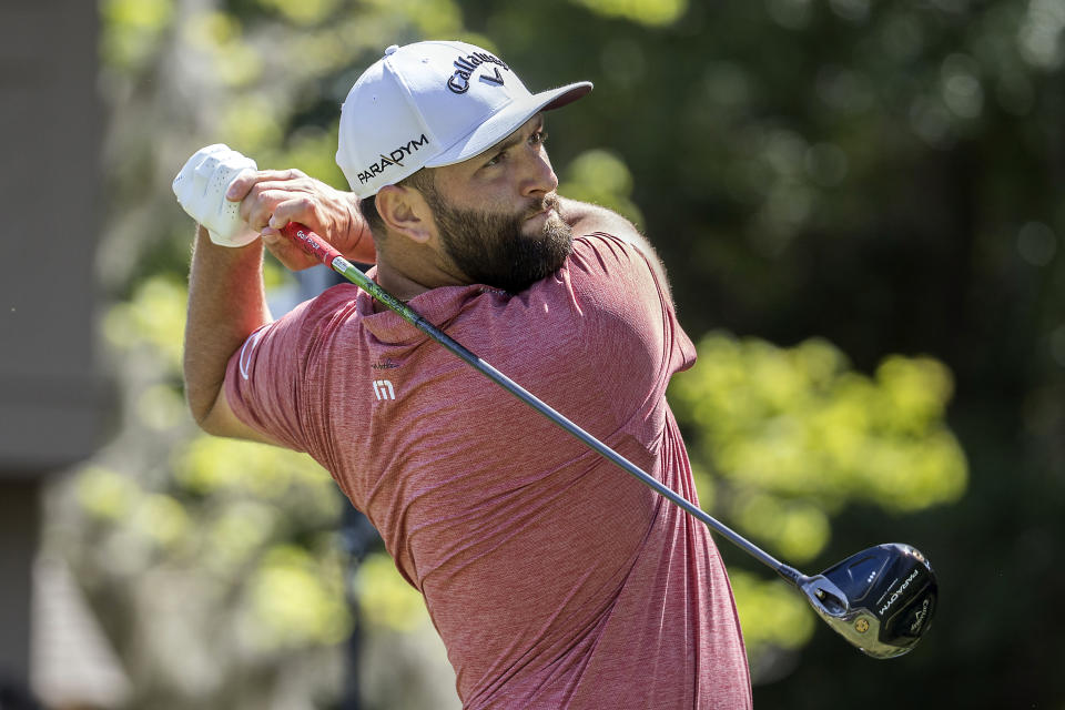 Jon Rahm, of Spain, watches his drive off the third tee during the final round of the RBC Heritage golf tournament, Sunday, April 16, 2023, in Hilton Head Island, S.C. (AP Photo/Stephen B. Morton)
