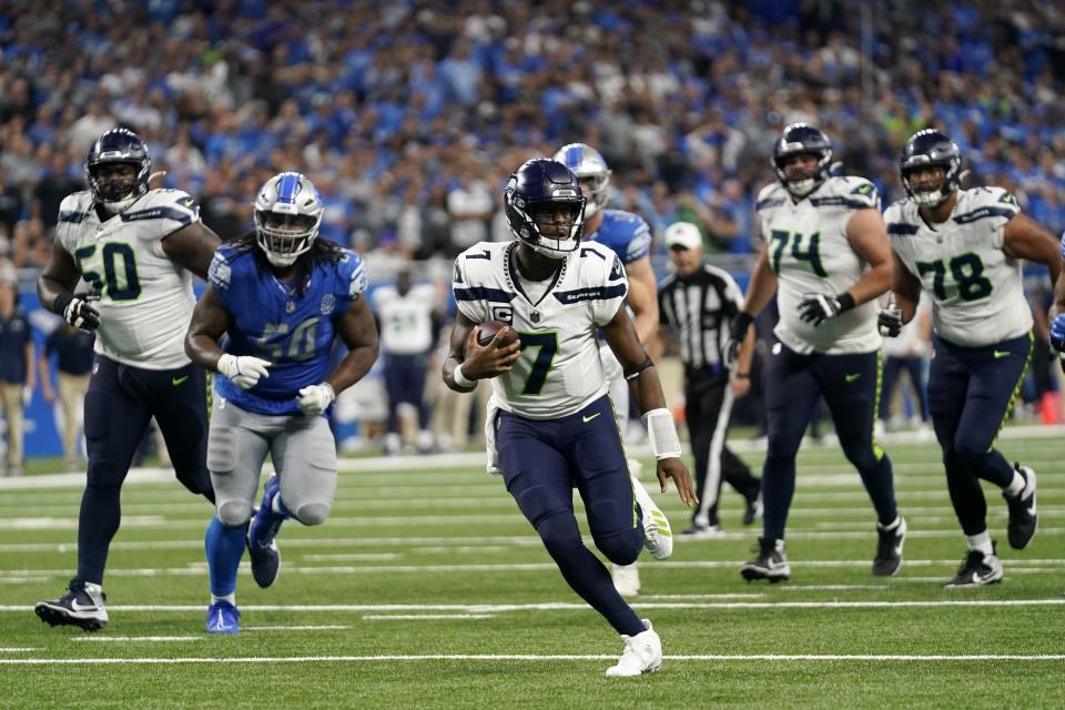 Seattle Seahawks quarterback Geno Smith (7) scrambles up field during the second half of an NFL football game against the Detroit Lions, Sunday, Sept. 17, 2023, in Detroit. (AP Photo/Paul Sancya)