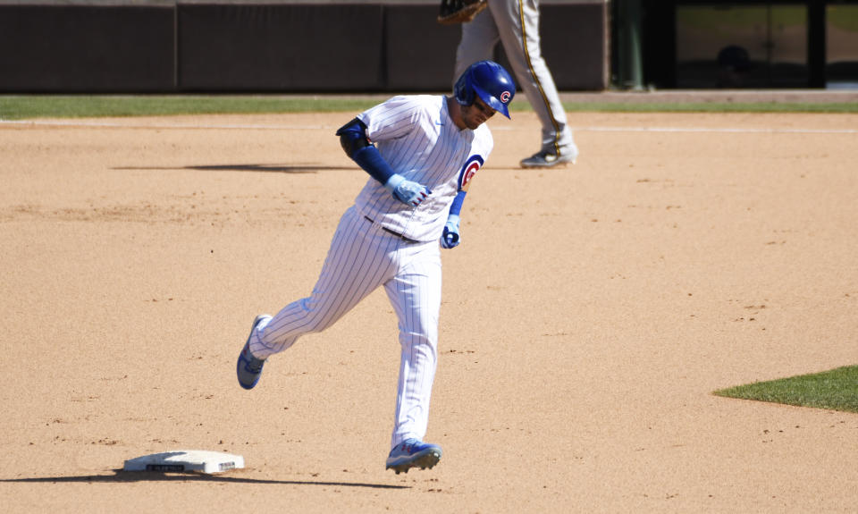 Chicago Cubs' Ian Happ runs the bases after hitting a two-run home run against the Milwaukee Brewers during the eighth inning of a baseball game Sunday, July, 26, 2020, in Chicago. (AP Photo/David Banks)