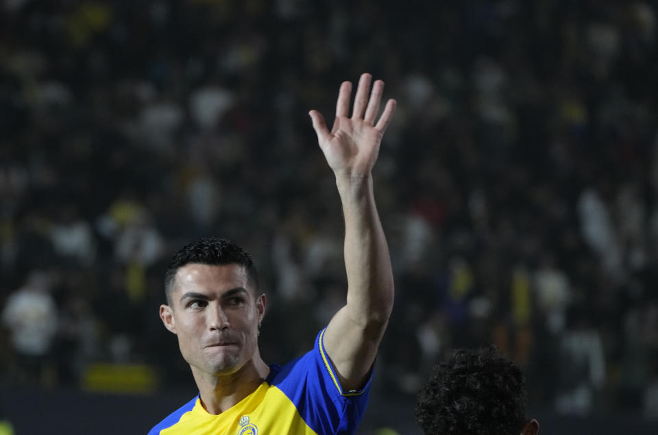 Cristiano Ronaldo greets Saudi fans during his official unveiling as a new member of Al Nassr soccer club in in Riyadh, Saudi Arabia, Tuesday, Jan. 3, 2023. Ronaldo, who has won five Ballon d'Ors awards for the best soccer player in the world and five Champions League titles, will play outside of Europe for the first time in his storied career. (AP Photo/Amr Nabil)