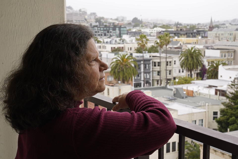 Census taker Linda Rothfield looks out at the Mission District area where she worked in San Francisco, on Wednesday, June 30, 2021. Some census takers worry that renters in apartment buildings were not tallied fully during the nation's head count last year. Census takers say they had difficulty entering apartment buildings due to COVID restrictions, and they weren't able to get in touch with landlords for help. (AP Photo/Eric Risberg)