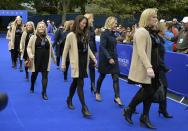 The wives of the U.S. Team (L) and Team Europe arrive for the opening ceremony of the 40th Ryder Cup, at Gleneagles in Scotland September 25, 2014. REUTERS/Toby Melville (BRITAIN - Tags: SPORT GOLF)