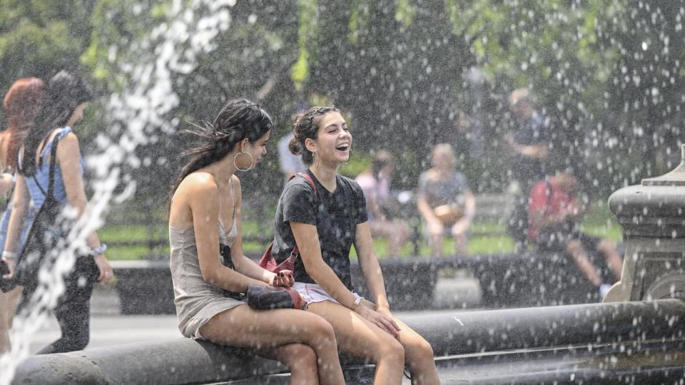 PHOTO: People spend time near a fountain during extreme heat wave in New York, July 27, 2023. (Anadolu Agency via Getty Images, FILE)