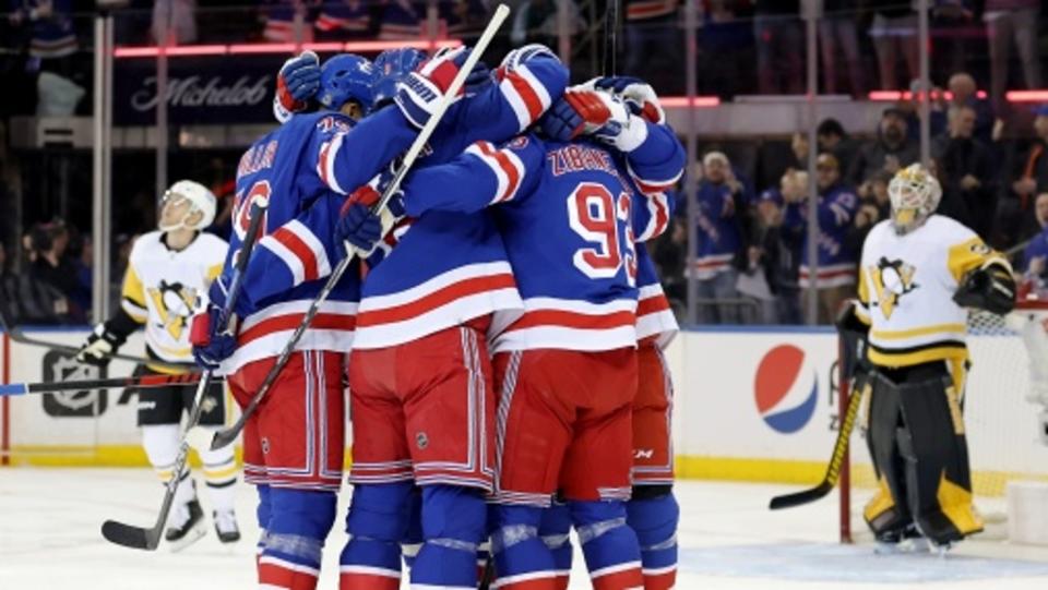 New York Rangers center Mika Zibanejad (93) celebrates his goal against Pittsburgh Penguins goaltender Tristan Jarry (35) with teammates during the first period at Madison Square Garden