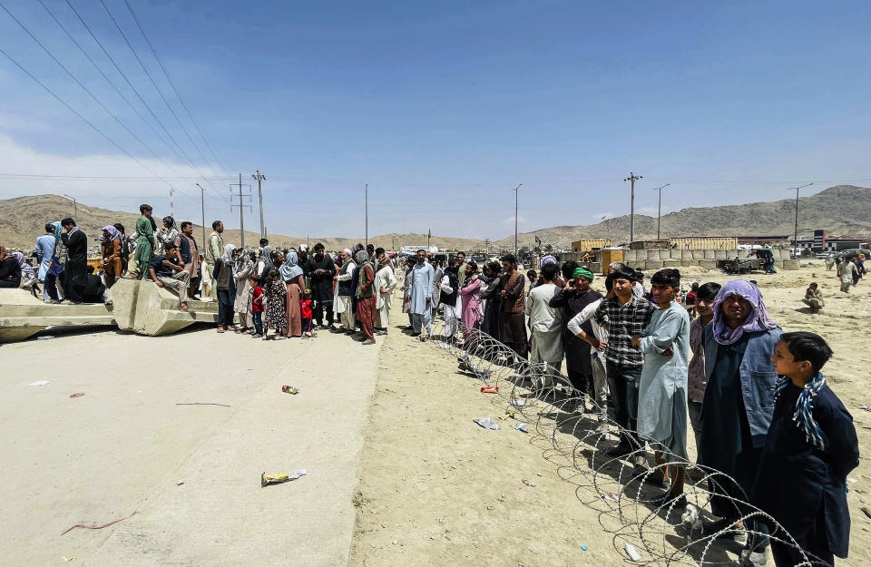 Image: Hundreds of people gather outside the international airport in Kabul, Afghanistan on Aug. 17, 2021. (AP)
