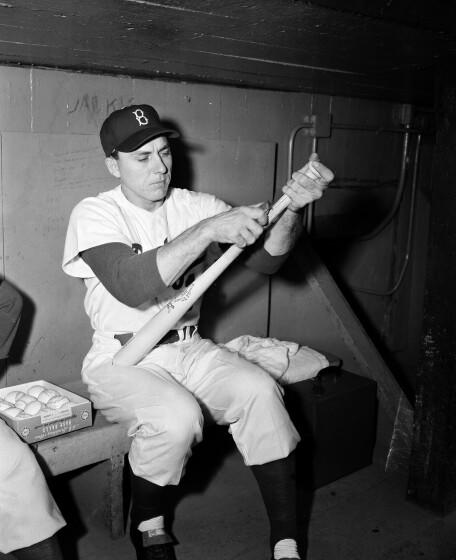 Brooklyn Dodgers' first baseman Gil Hodges shaves a new bat in New York, Oct. 1, 1952. (AP Photo/Dan Grossi)