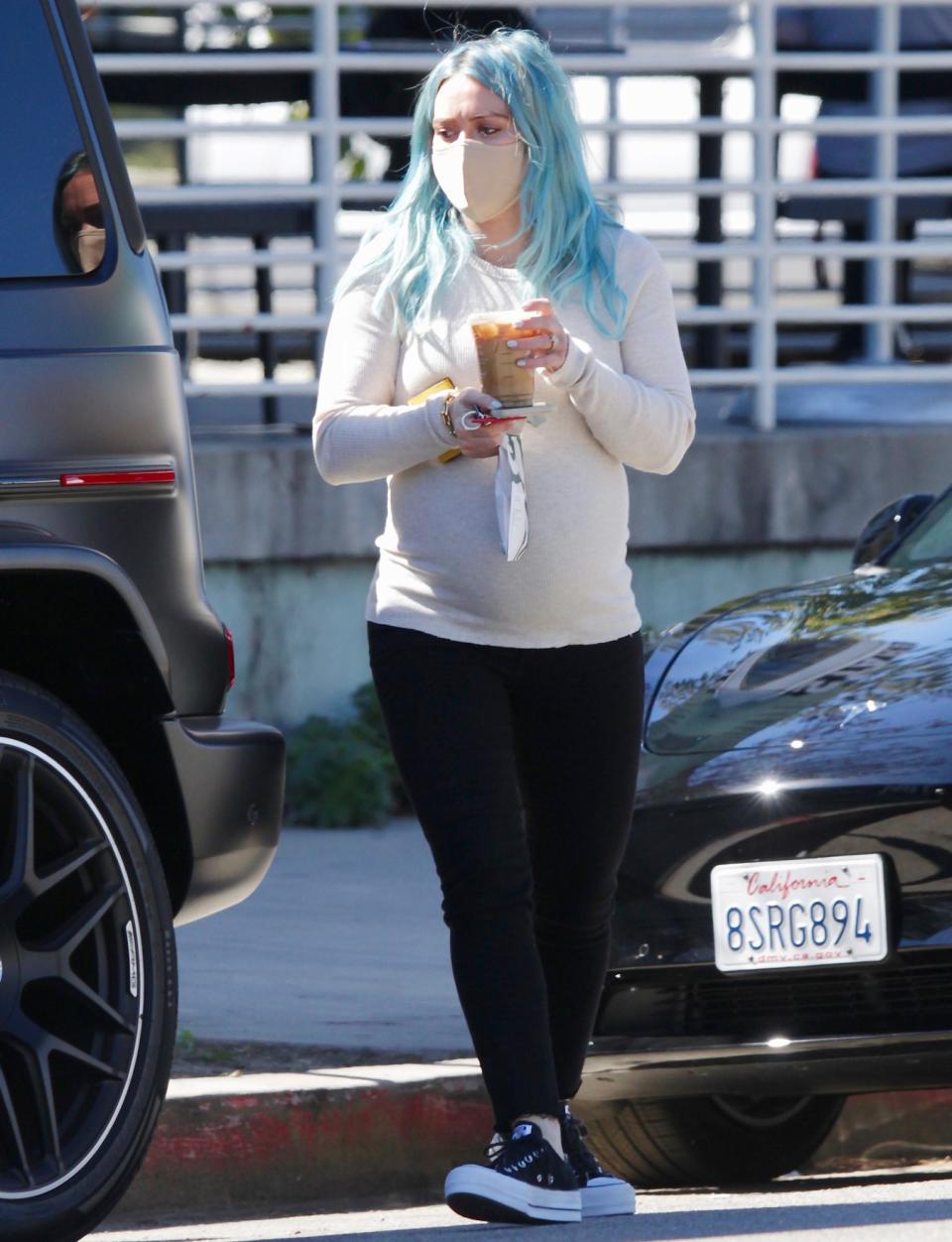 <p>Hilary Duff rocks blue locks while grabbing a coffee in L.A. on Monday. </p>