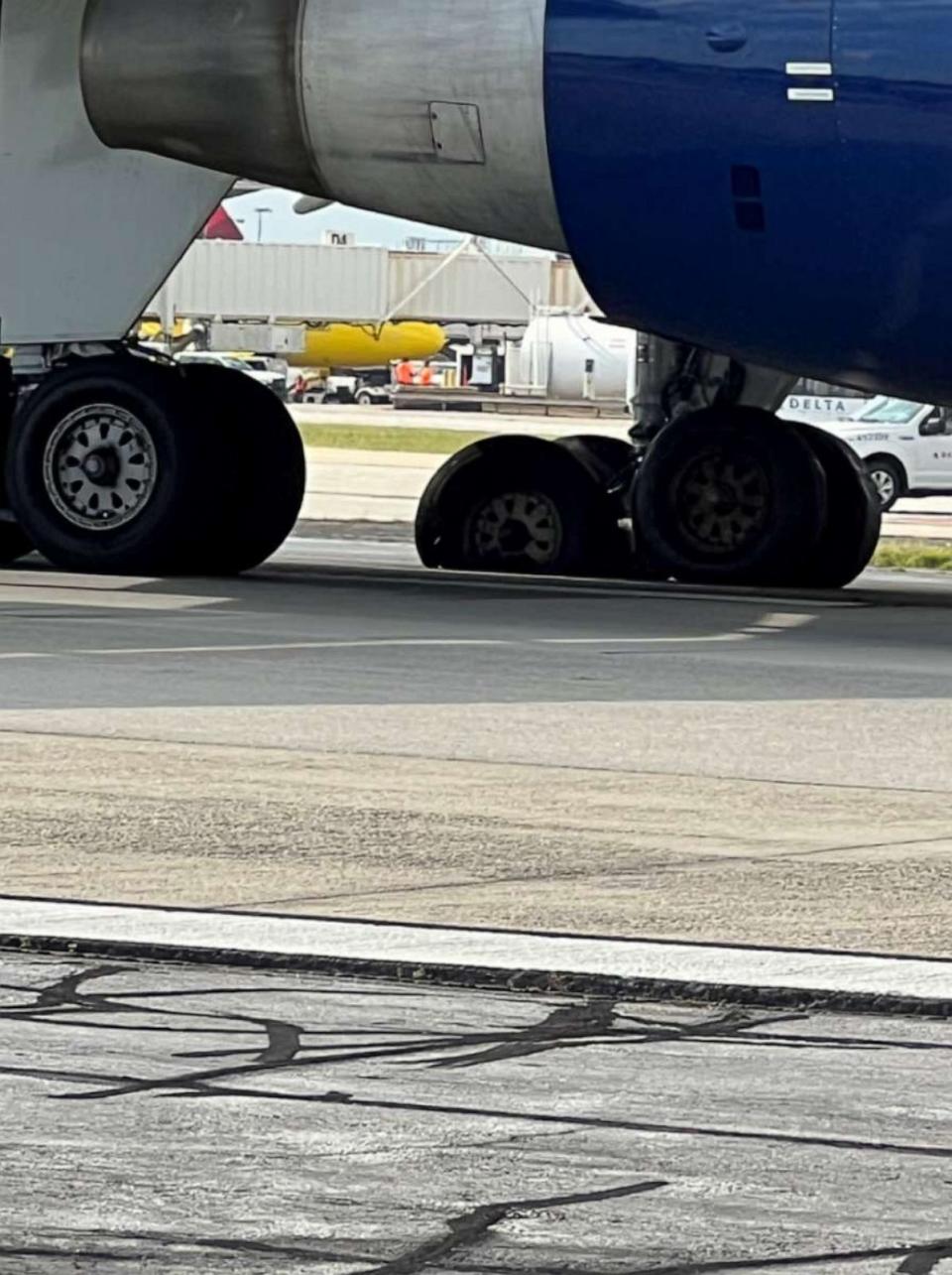 PHOTO: Passengers on a Delta flight make an emergency evacuation at Hartsfield-Jackson Atlanta International Airport on Aug. 2, 2023, after one tire popped and another was shredded as they landed. (Jean Druckenmiller)