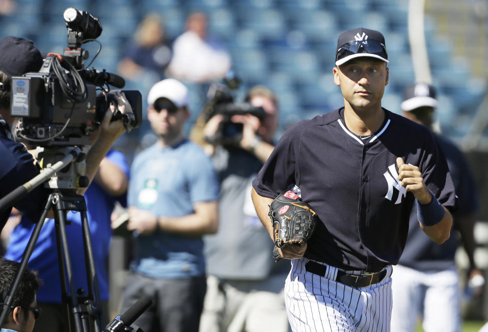 New York Yankees shortstop Derek Jeter runs to the field before a spring training baseball practice Thursday, Feb. 20, 2014, in Tampa, Fla. (AP Photo/Charlie Neibergall)