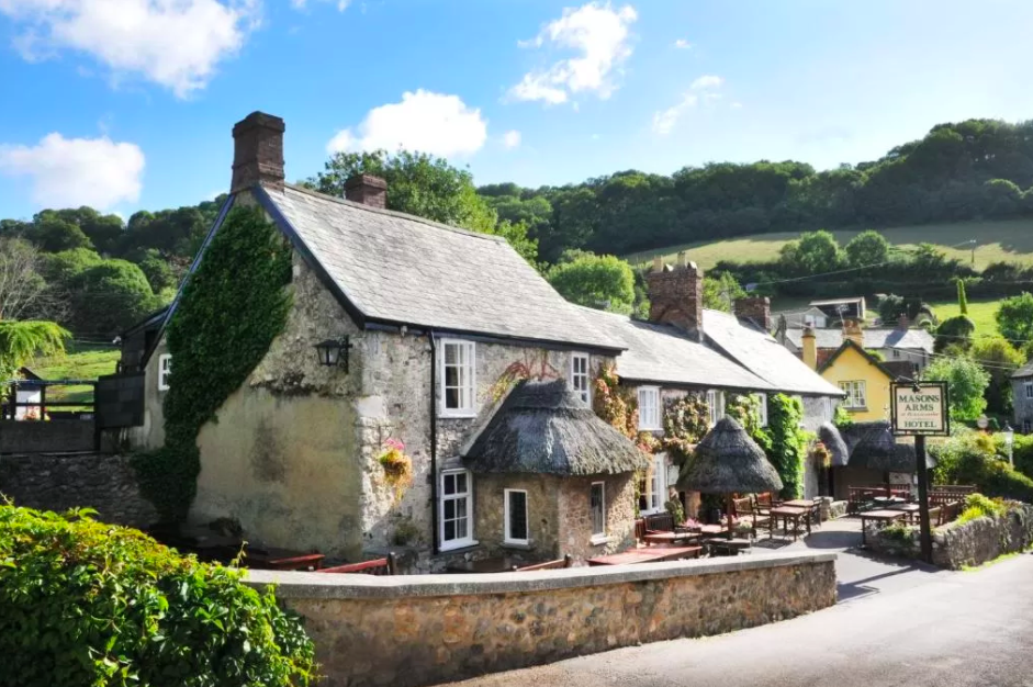 <p><a href="https://www.booking.com/hotel/gb/the-masons-arms-branscombe.en-gb.html?aid=1922306&label=staycation-uk" rel="nofollow noopener" target="_blank" data-ylk="slk:The Masons Arms;elm:context_link;itc:0;sec:content-canvas" class="link ">The Masons Arms</a>’ in Branscombe, believed to be the longest village in England, occupies a position nestled amongst the quaint thatched cottages, with a luscious hilly backdrop. </p><p>The 14th century thatched inn boasts 27 contemporary bedrooms, a cosy bar complete with inglenook fireplace and a comfortable, relaxed ambience. </p><p>The area sweeps towards Branscombe Beach, a long shingle cove, where keen walkers can join the South West Coastal Path and less keen0walkers can dip their toes in the cool (read: chilly) waters.</p><p>Meander into the village to explore its working forge and grab a baked treat from the old bakery, or venture further afield to take advantage of fossil hunting along the Jurassic Coast. </p><p><a class="link " href="https://www.goodhousekeepingholidays.com/offers/devon-branscombe-masons-arms-hotel" rel="nofollow noopener" target="_blank" data-ylk="slk:READ OUR REVIEW;elm:context_link;itc:0;sec:content-canvas">READ OUR REVIEW</a></p><p><a class="link " href="https://www.booking.com/hotel/gb/the-masons-arms-branscombe.en-gb.html?aid=1922306&label=staycation-uk" rel="nofollow noopener" target="_blank" data-ylk="slk:BOOK A ROOM;elm:context_link;itc:0;sec:content-canvas">BOOK A ROOM</a></p>